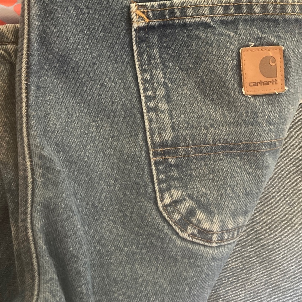 Carhartt Men's Faded Blue Relaxed Denim Jeans with Logo Patch